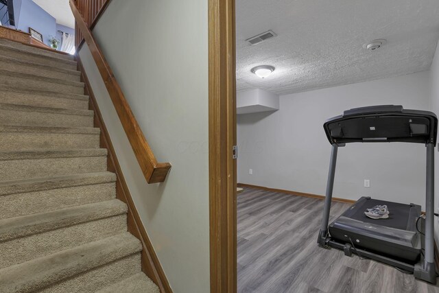 224 Macandrews Way Unit 60A, Blacklick, OH 43004 - exercise area with wood finished floors and a textured ceiling