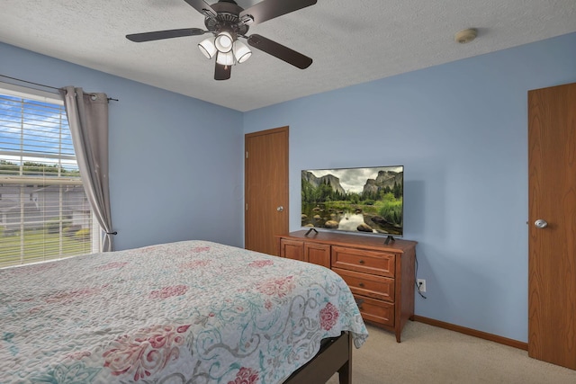 224 Macandrews Way Unit 60A, Blacklick, OH 43004 - bedroom with light colored carpet, a textured ceiling, and ceiling fan