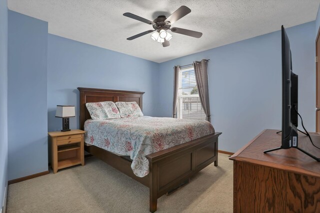 224 Macandrews Way Unit 60A, Blacklick, OH 43004 - bedroom featuring light colored carpet, a textured ceiling, and a ceiling fan