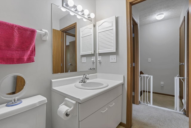 224 Macandrews Way Unit 60A, Blacklick, OH 43004 - bathroom featuring a textured ceiling and vanity