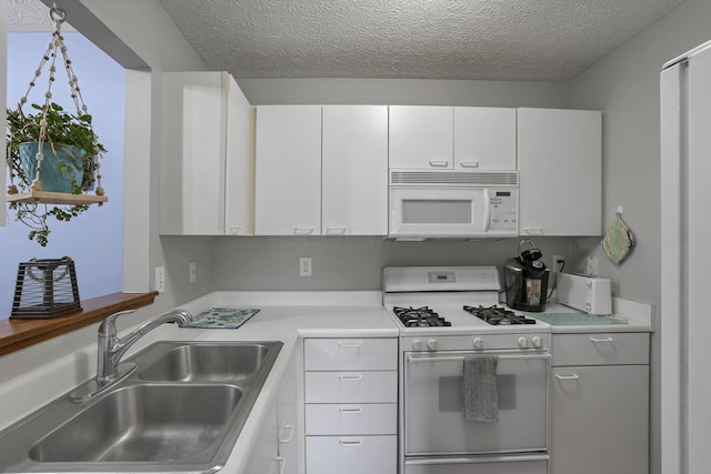 224 Macandrews Way Unit 60A, Blacklick, OH 43004 - kitchen featuring white appliances, white cabinetry, a textured ceiling, and light countertops