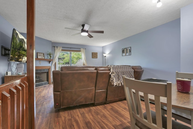 224 Macandrews Way Unit 60A, Blacklick, OH 43004 - living area featuring a ceiling fan, dark wood finished floors, a textured ceiling, and a fireplace
