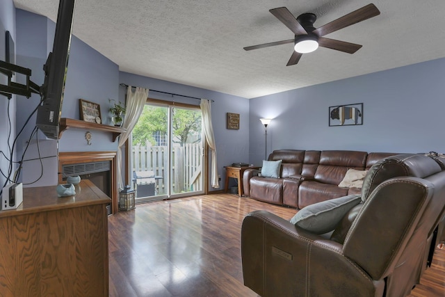 224 Macandrews Way Unit 60A, Blacklick, OH 43004 - living area with ceiling fan, dark wood-style flooring, a textured ceiling, and a glass covered fireplace