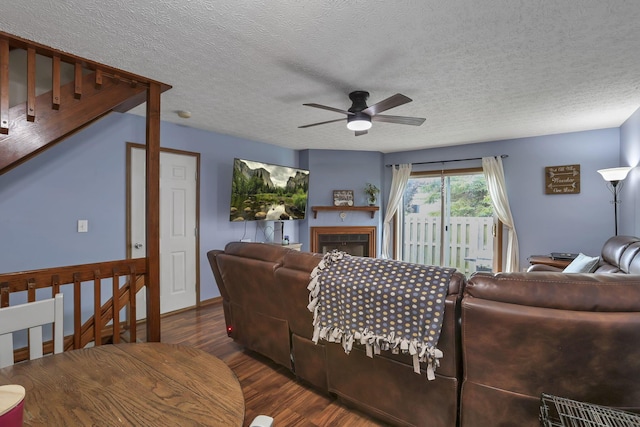 224 Macandrews Way Unit 60A, Blacklick, OH 43004 - living area with ceiling fan, wood finished floors, a textured ceiling, and a fireplace