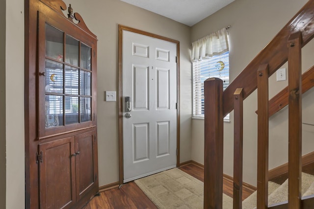 224 Macandrews Way Unit 60A, Blacklick, OH 43004 - entrance foyer with dark wood-type flooring and baseboards