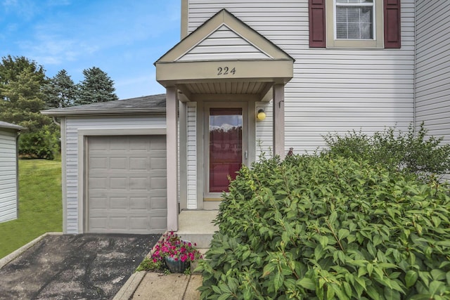 224 Macandrews Way Unit 60A, Blacklick, OH 43004 - doorway to property featuring an attached garage and driveway