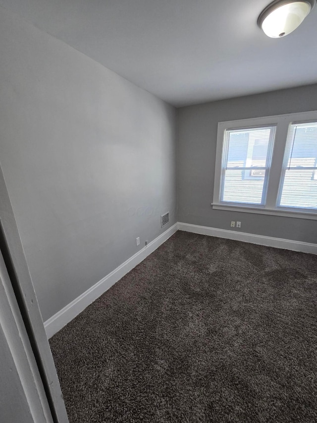 2205-2207 Sullivant Ave, Columbus, OH 43223 - spare room with baseboards and dark carpet