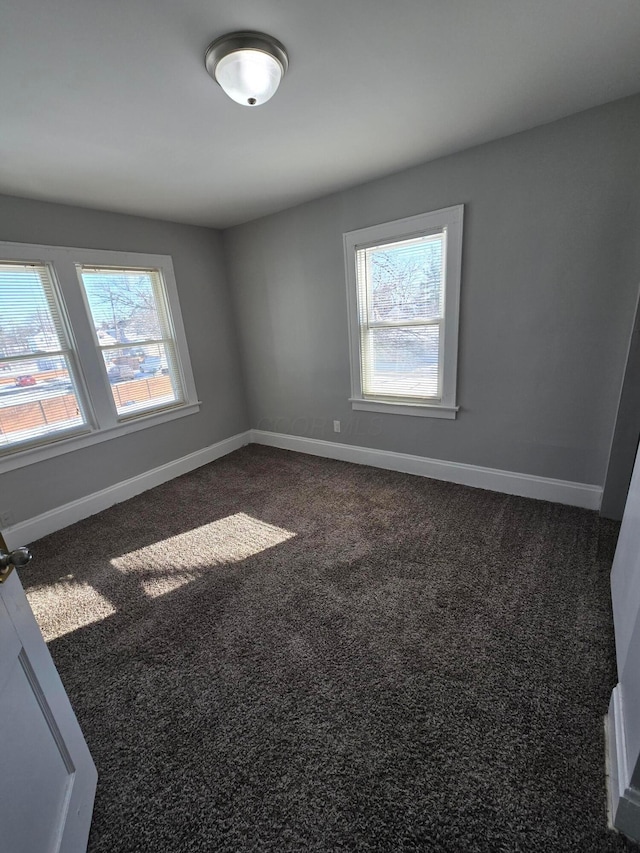 2205-2207 Sullivant Ave, Columbus, OH 43223 - unfurnished room with baseboards and dark colored carpet