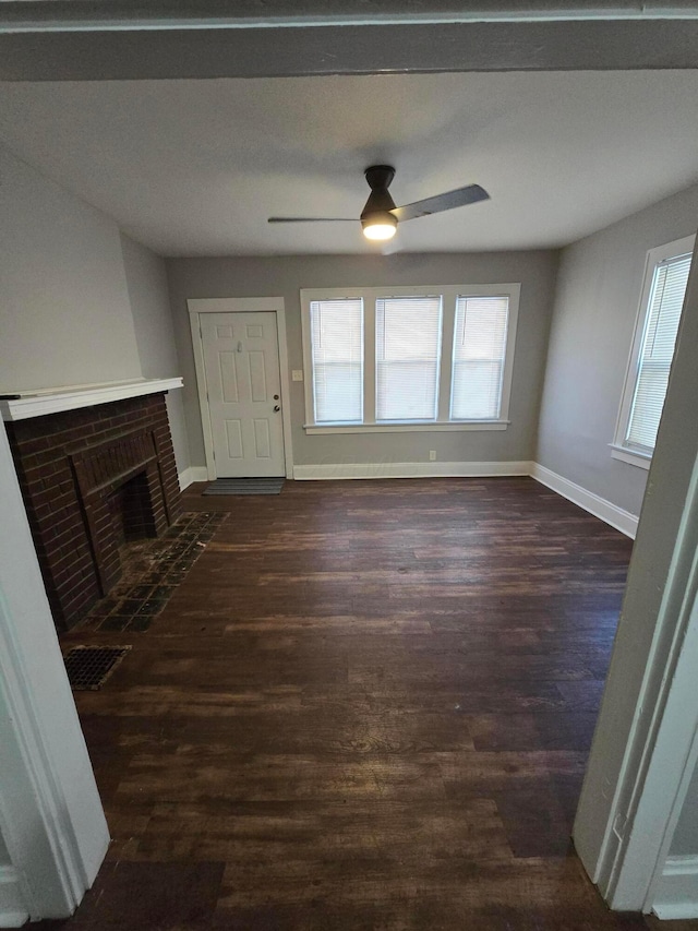 2205-2207 Sullivant Ave, Columbus, OH 43223 - unfurnished living room with a ceiling fan, dark wood finished floors, and a fireplace