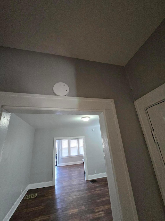 2205-2207 Sullivant Ave, Columbus, OH 43223 - hallway featuring baseboards and dark wood-type flooring