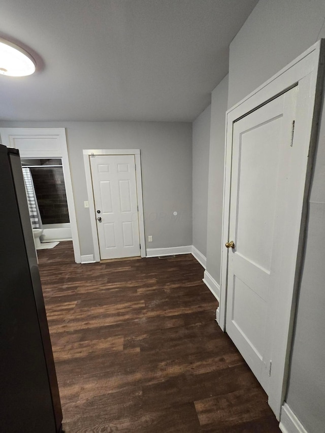 2205-2207 Sullivant Ave, Columbus, OH 43223 - foyer entrance with baseboards and dark wood-type flooring
