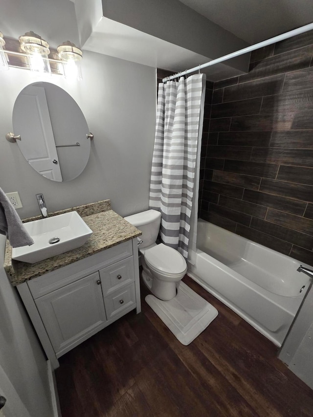 2205-2207 Sullivant Ave, Columbus, OH 43223 - full bathroom with vanity, shower / bath combo with shower curtain, and wood finished floors