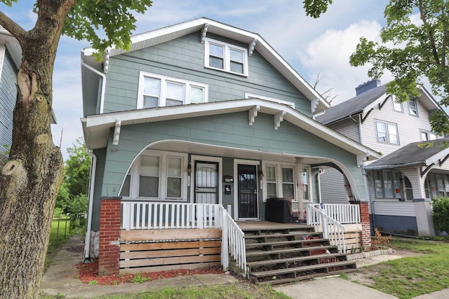 2205-2207 Sullivant Ave, Columbus, OH 43223 - view of front facade with covered porch and brick siding