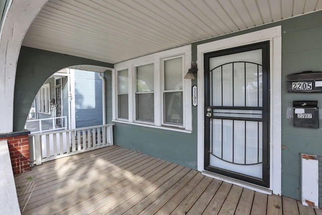 2205-2207 Sullivant Ave, Columbus, OH 43223 - view of exterior entry featuring covered porch and concrete block siding
