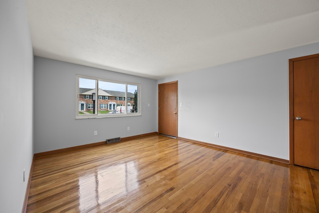 1033 Folkestone Rd, Columbus, OH 43220 - empty room featuring light wood finished floors and a textured ceiling