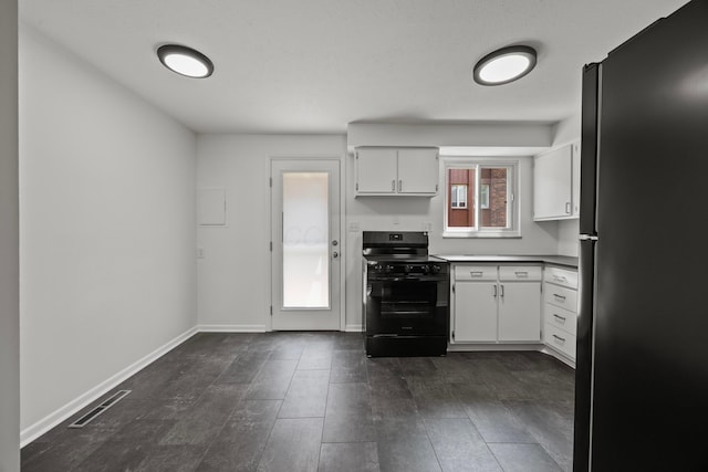 1033 Folkestone Rd, Columbus, OH 43220 - kitchen featuring freestanding refrigerator, electric range, white cabinets, and dark wood finished floors