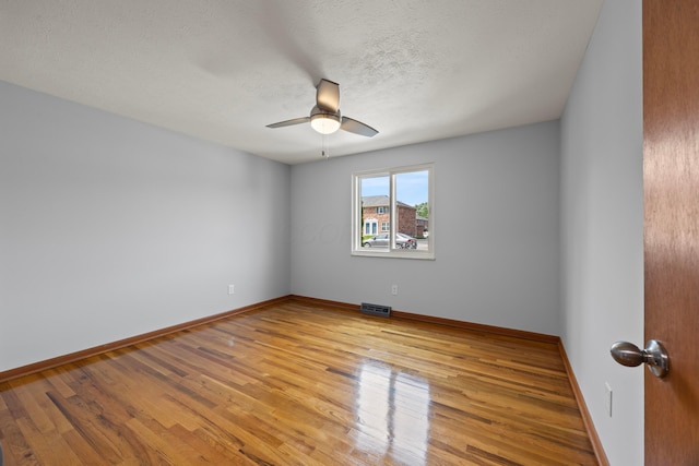1033 Folkestone Rd, Columbus, OH 43220 - spare room featuring ceiling fan, wood finished floors, and a textured ceiling