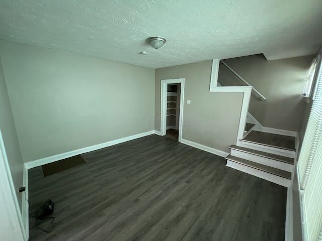 1514-1516 E 26th Ave, Columbus, OH 43211 - stairs featuring wood finished floors and a textured ceiling