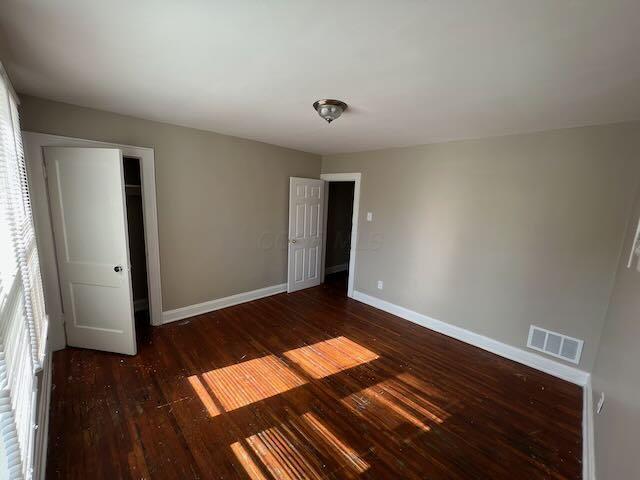 1514-1516 E 26th Ave, Columbus, OH 43211 - unfurnished bedroom with baseboards and wood finished floors