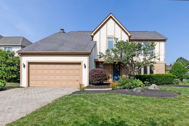 271 Crawford Ct, Westerville, OH 43082 - view of front of home featuring stucco siding, an attached garage, decorative driveway, a front lawn, and a chimney