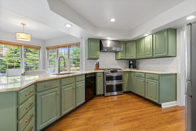 271 Crawford Ct, Westerville, OH 43082 - kitchen featuring wall chimney exhaust hood, black dishwasher, range with two ovens, green cabinetry, and plenty of natural light