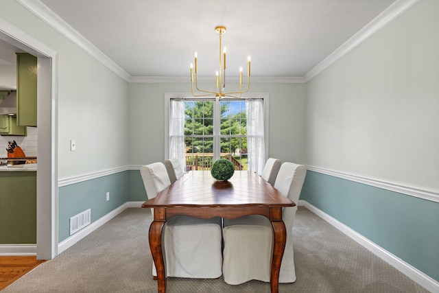 271 Crawford Ct, Westerville, OH 43082 - carpeted dining space featuring a chandelier and crown molding