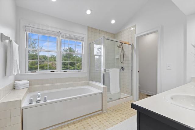 271 Crawford Ct, Westerville, OH 43082 - bathroom featuring a bath, a stall shower, double vanity, lofted ceiling, and recessed lighting