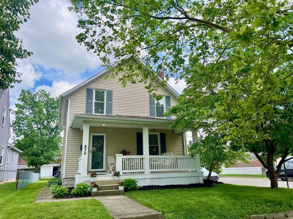 874 Chelsea Ave, Bexley, OH 43209 - view of front of home with covered porch, a front yard, and a chimney