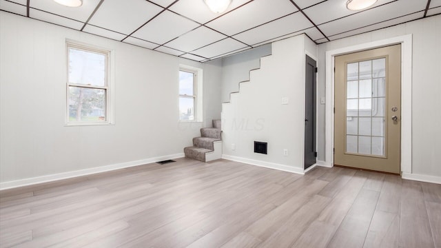 215 S Market St, Somerset, OH 43783 - spare room featuring stairway, light wood-style floors, and plenty of natural light