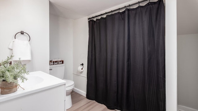 215 S Market St, Somerset, OH 43783 - bathroom with vanity, wood finished floors, and a shower with shower curtain