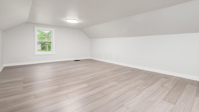 215 S Market St, Somerset, OH 43783 - additional living space with light wood-style flooring and vaulted ceiling