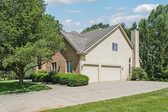 1318 Retreat Ln, New Albany, OH 43054 - view of front of house featuring concrete driveway, a chimney, a front yard, an attached garage, and a shingled roof