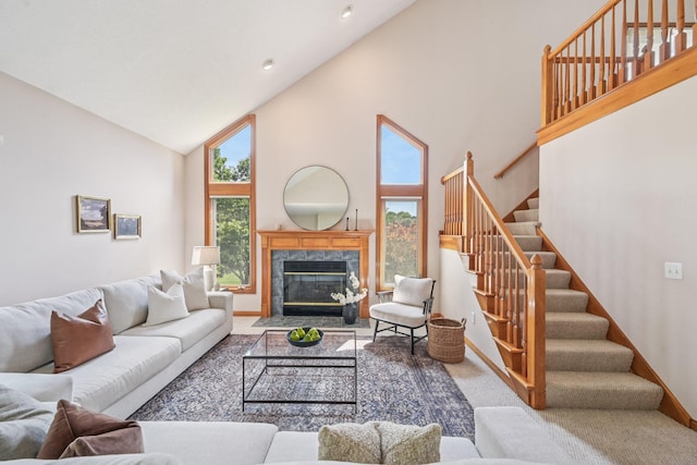 1318 Retreat Ln, New Albany, OH 43054 - carpeted living room featuring high vaulted ceiling, stairs, and a high end fireplace