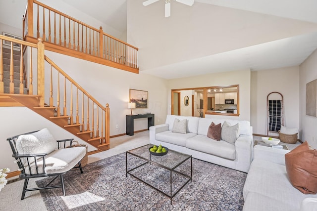 1318 Retreat Ln, New Albany, OH 43054 - living area with carpet flooring, stairway, high vaulted ceiling, and ceiling fan
