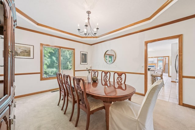 1318 Retreat Ln, New Albany, OH 43054 - dining space with light carpet, a chandelier, a raised ceiling, and crown molding