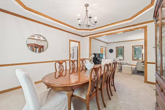 1318 Retreat Ln, New Albany, OH 43054 - dining room featuring light colored carpet, a chandelier, a raised ceiling, and crown molding