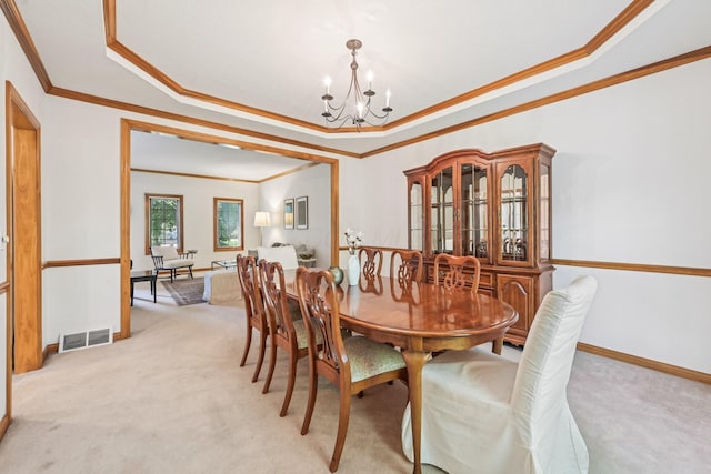 1318 Retreat Ln, New Albany, OH 43054 - dining room with a chandelier, light carpet, ornamental molding, and a raised ceiling