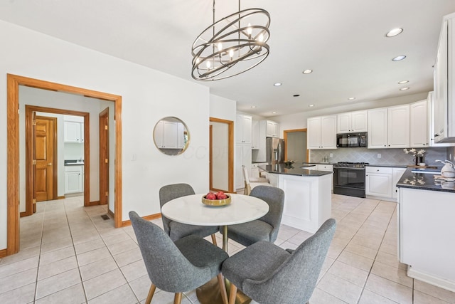 1318 Retreat Ln, New Albany, OH 43054 - dining space featuring light tile patterned flooring, a chandelier, and recessed lighting