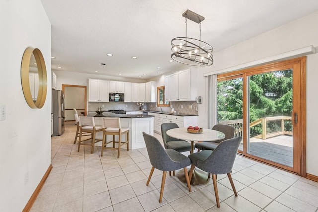 1318 Retreat Ln, New Albany, OH 43054 - dining space featuring light tile patterned flooring, a chandelier, and recessed lighting