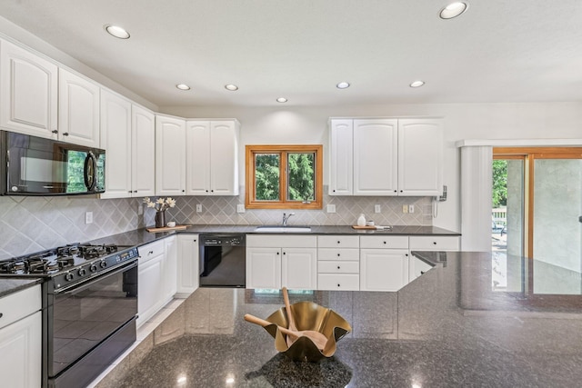 1318 Retreat Ln, New Albany, OH 43054 - kitchen with black appliances, healthy amount of natural light, dark stone countertops, white cabinets, and recessed lighting