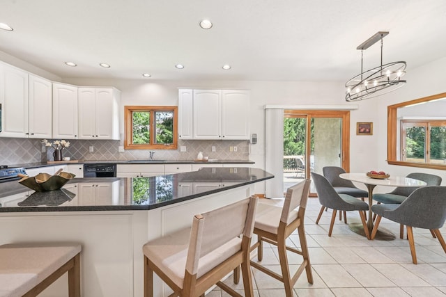 1318 Retreat Ln, New Albany, OH 43054 - kitchen featuring plenty of natural light, light tile patterned floors, backsplash, and recessed lighting