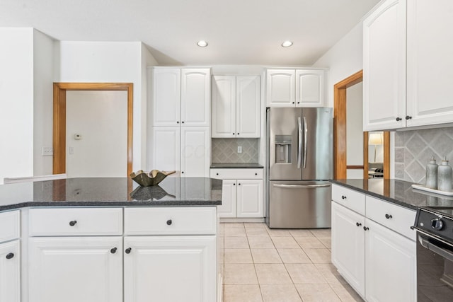 1318 Retreat Ln, New Albany, OH 43054 - kitchen with stainless steel fridge, backsplash, light tile patterned floors, dark stone countertops, and recessed lighting