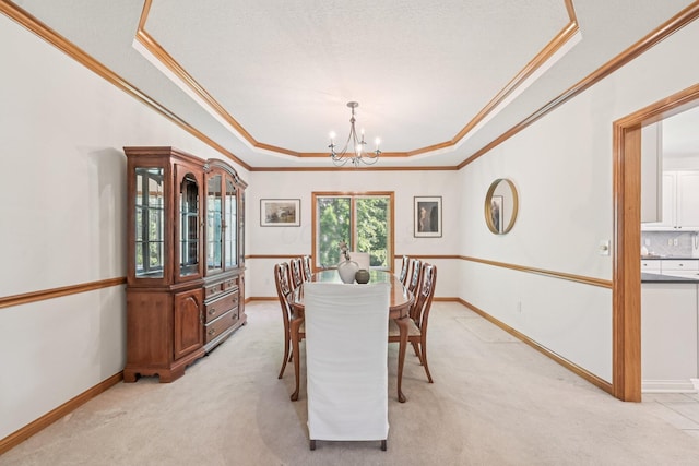 1318 Retreat Ln, New Albany, OH 43054 - dining space featuring a tray ceiling, crown molding, a chandelier, and light carpet