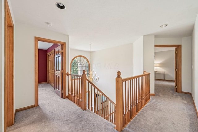 1318 Retreat Ln, New Albany, OH 43054 - corridor with carpet floors, an upstairs landing, a chandelier, and recessed lighting