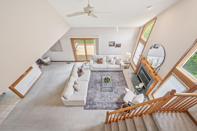 1318 Retreat Ln, New Albany, OH 43054 - living room with a ceiling fan, a fireplace with flush hearth, and carpet