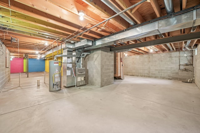 1318 Retreat Ln, New Albany, OH 43054 - unfinished basement featuring gas water heater, heating unit, and concrete block wall