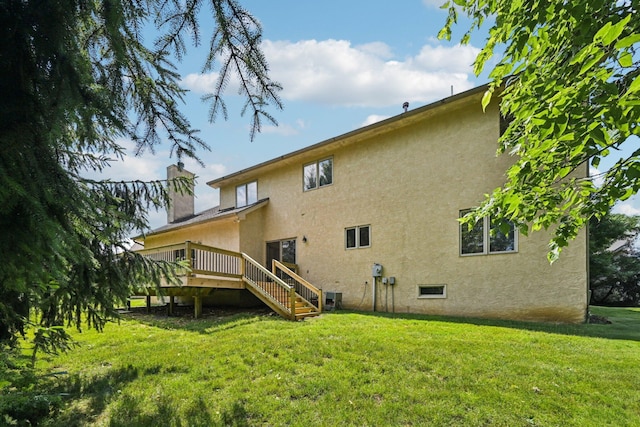 1318 Retreat Ln, New Albany, OH 43054 - back of house with stucco siding, a chimney, a yard, a wooden deck, and stairway