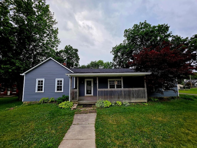 15588 Main St SE, Brownsville, OH 43721 - view of front of house featuring a front yard, a porch, and a chimney