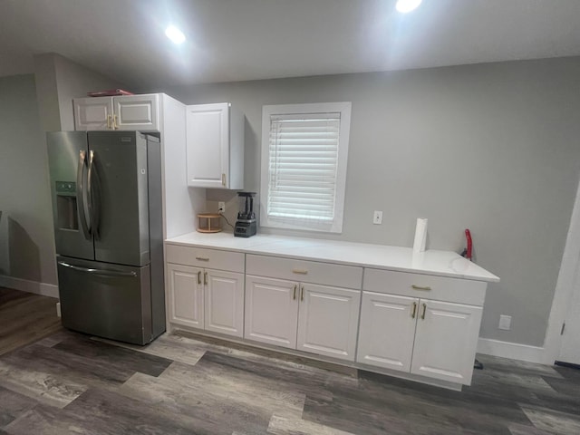 3107 Huntington Dr, Columbus, OH 43207 - kitchen with stainless steel refrigerator with ice dispenser, white cabinets, dark wood-type flooring, light countertops, and recessed lighting