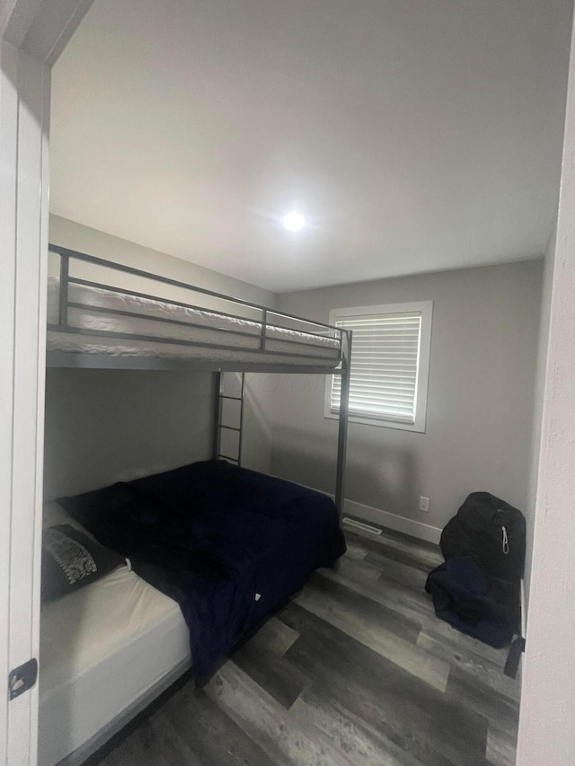 3107 Huntington Dr, Columbus, OH 43207 - unfurnished bedroom featuring wood finished floors and baseboards